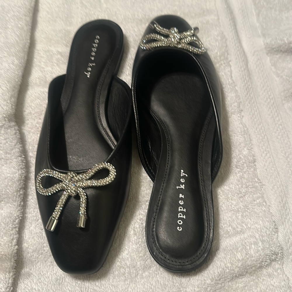 Cooper Key Mules with a bling bow. New without box. 
Size 9M